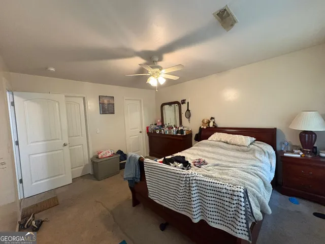 a bed room with a bed and a chandelier