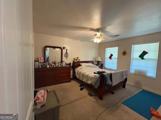 a bed room with a bed and a mirror