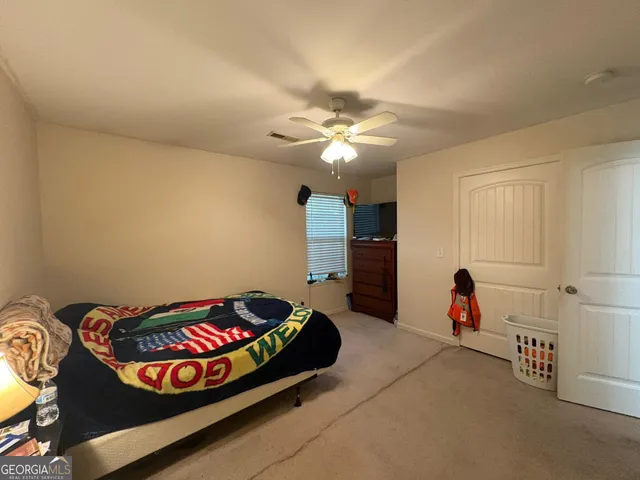 a bedroom with furniture and a chandelier