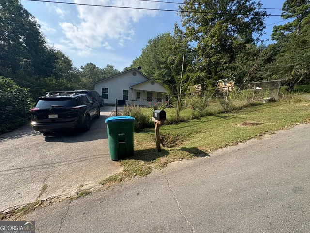 a view of a car parked in front of a house