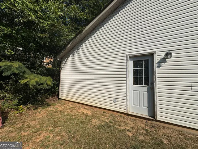a view of a pathway with a tree