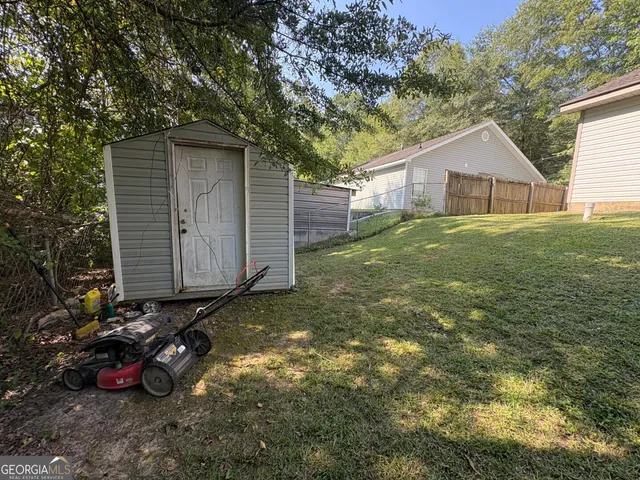 a backyard of a house with lots of green space