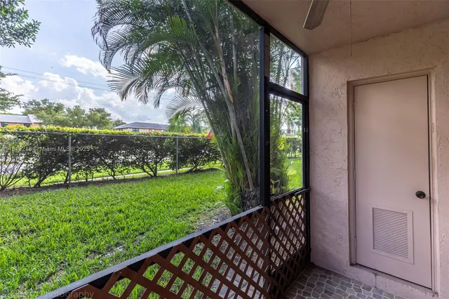 a view of a yard from a balcony