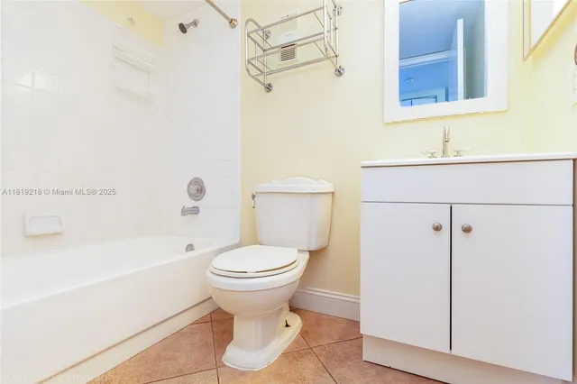 a bathroom with a toilet and a bathtub