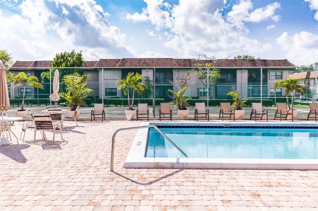 a view of a swimming pool with a patio