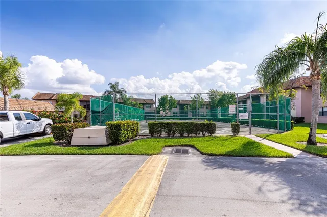 a view of an house with swimming pool and yard