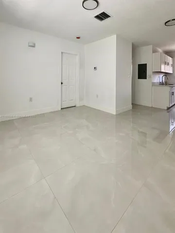 a view of a kitchen with a sink
