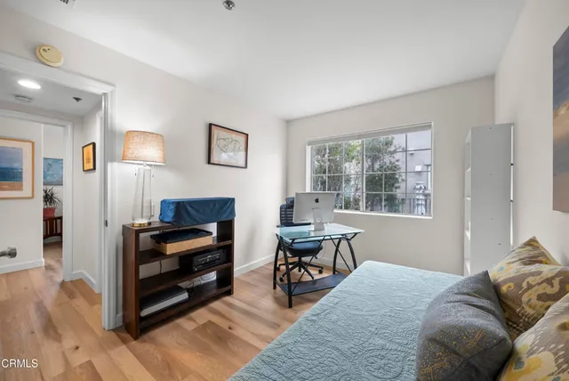 a bedroom with furniture and a window