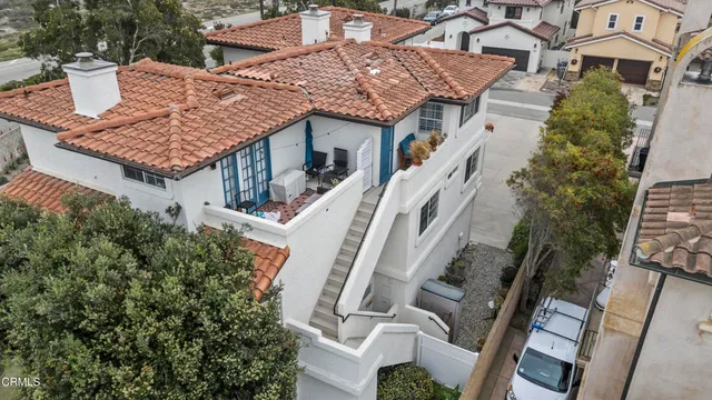 a aerial view of a house with balcony and garden