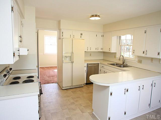 4512 Connell Drive Raleigh, NC 27612 - Photo 6 of 25 Huge Walk-in Pantry with shelves.....stainless steel dishwasher, and refrigerator included. Kitchen