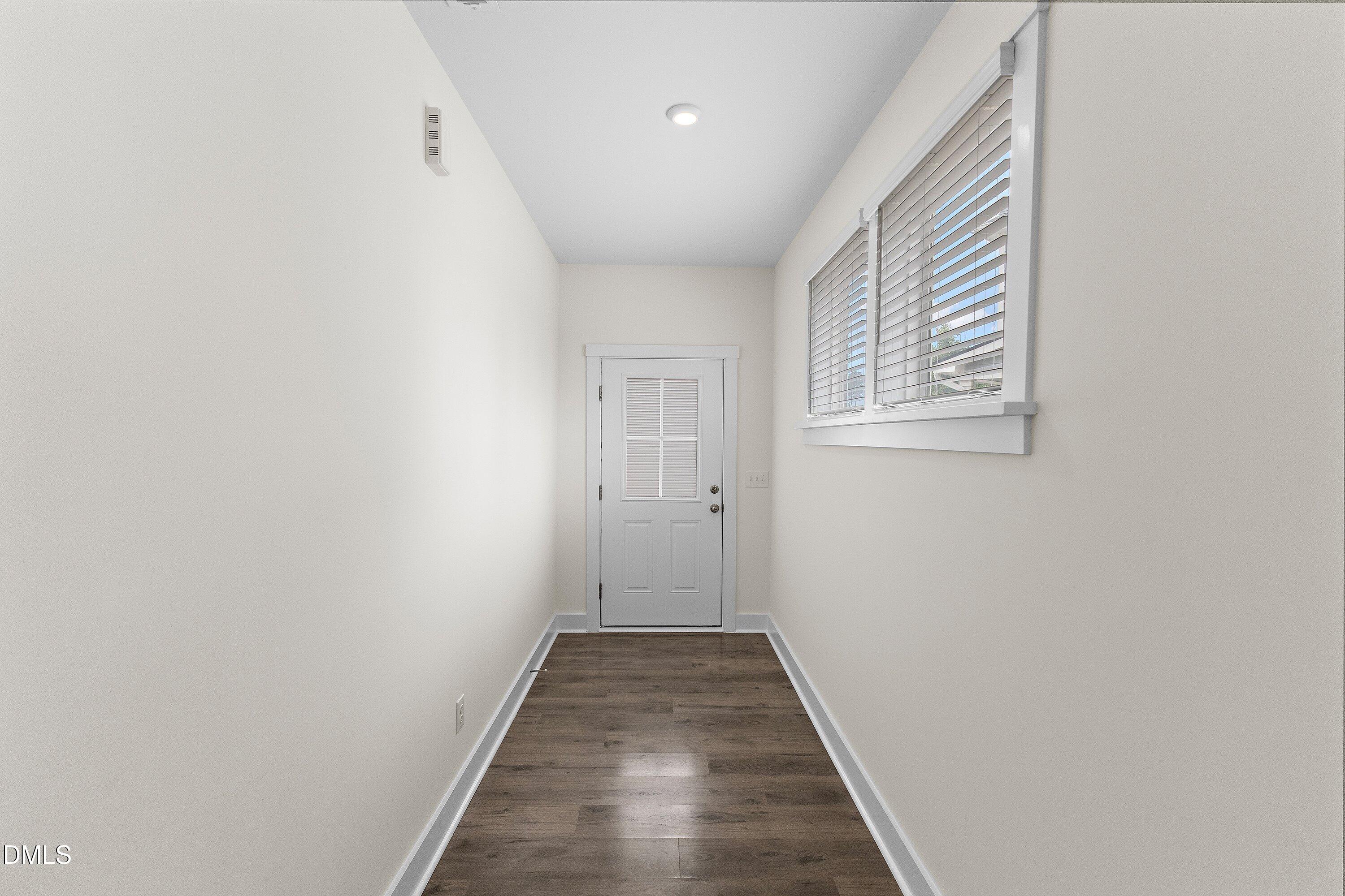 156 Sears Ridge Lane Morrisville, NC 27560 - Photo 4 of 49 a view of a hallway with wooden floor