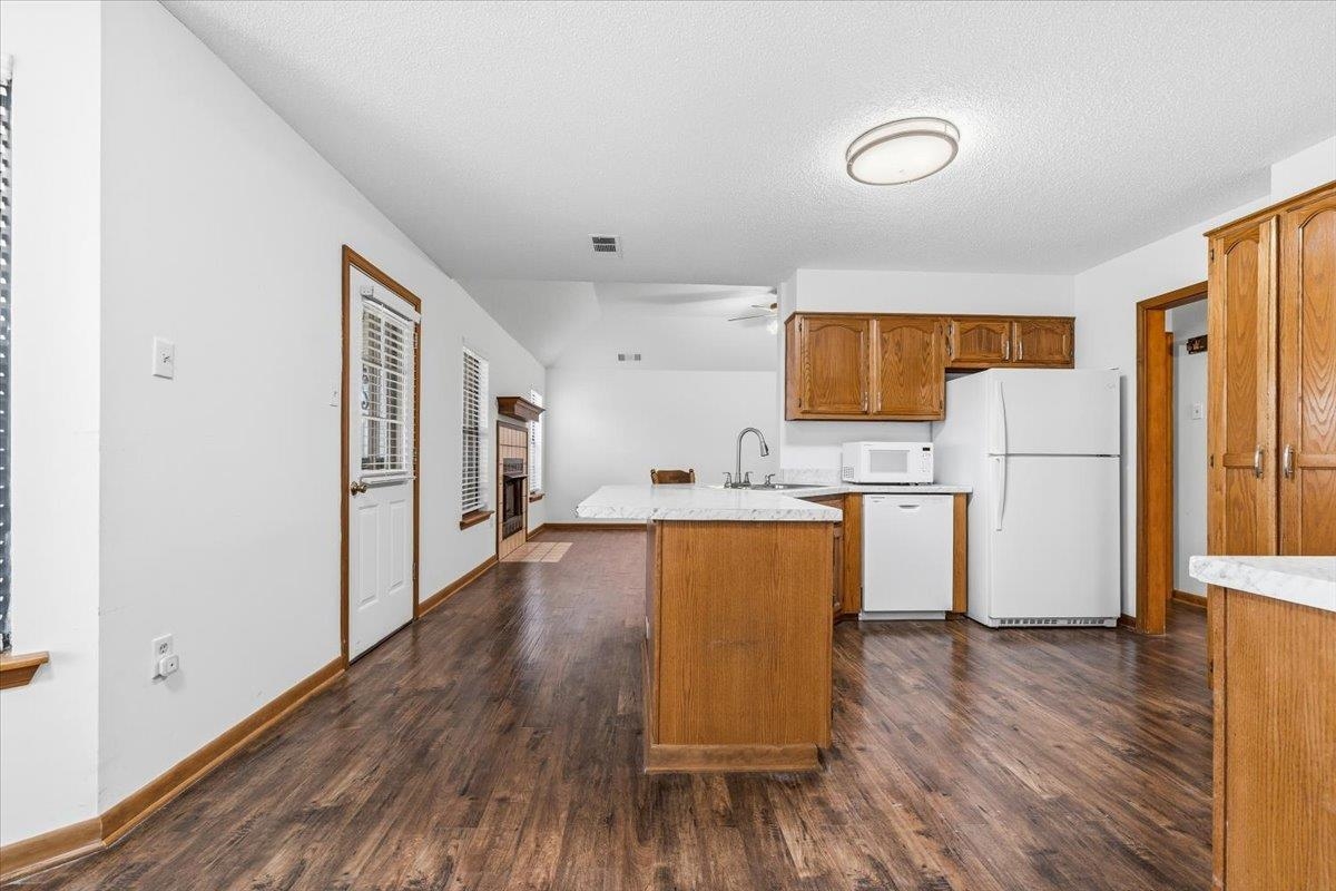 1426 Simmons Road Drummonds, TN 38023 - Photo 11 of 29 a kitchen with stainless steel appliances a refrigerator and a stove top oven