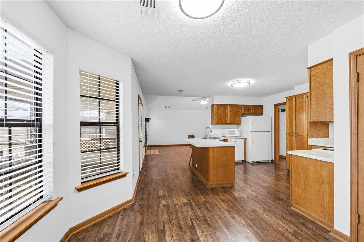 1426 Simmons Road Drummonds, TN 38023 - Photo 15 of 29 a view of a kitchen with wooden floor and a sink