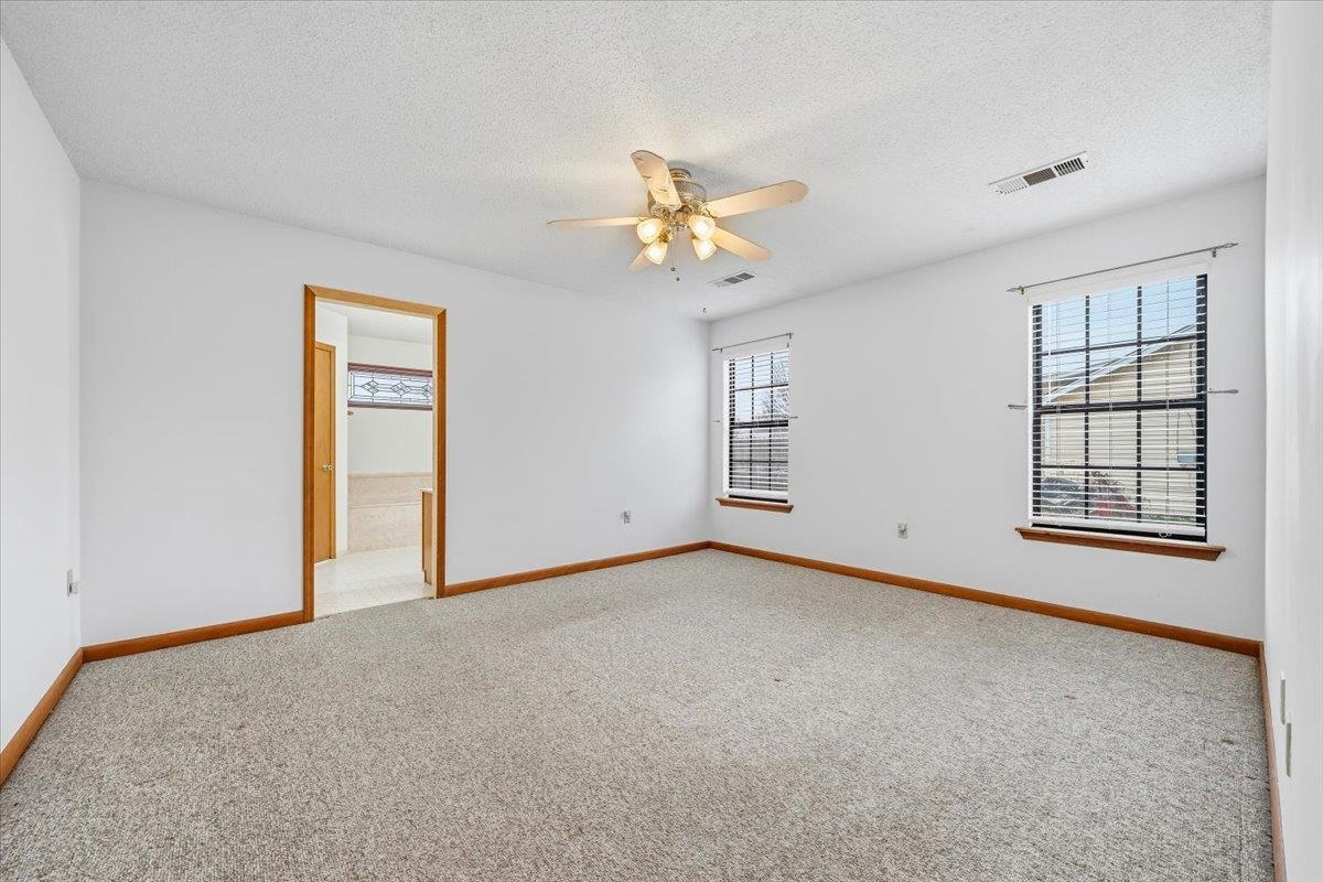 1426 Simmons Road Drummonds, TN 38023 - Photo 16 of 29 a view of a room with a ceiling fan and a window