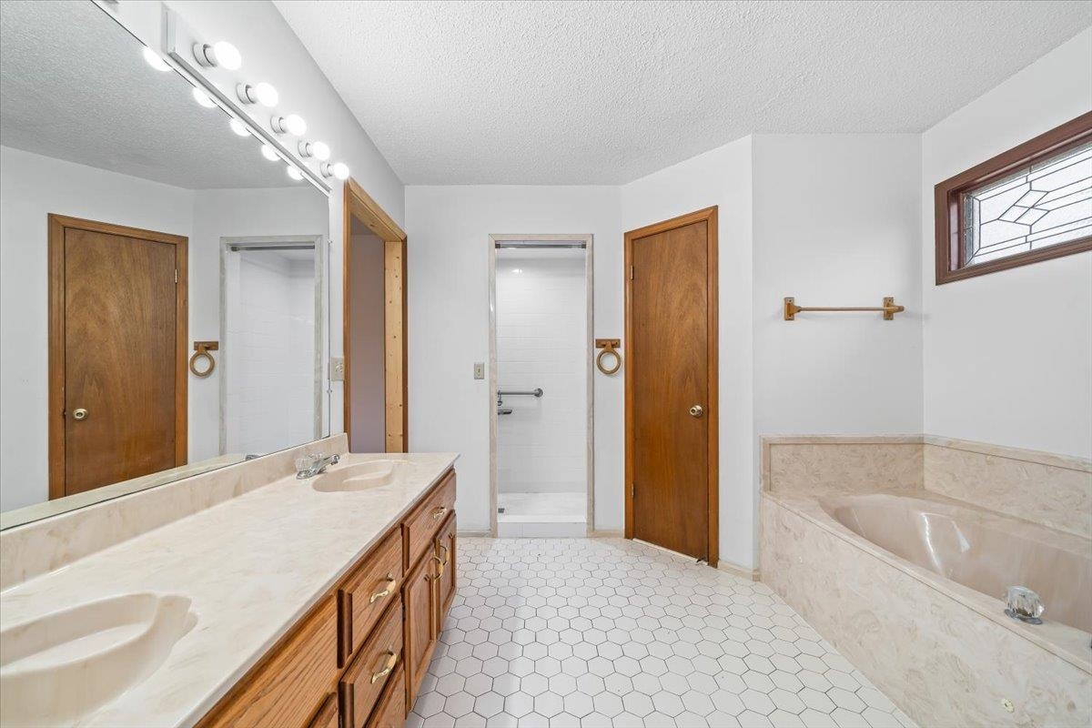 1426 Simmons Road Drummonds, TN 38023 - Photo 18 of 29 a spacious bathroom with a tub sink and mirror