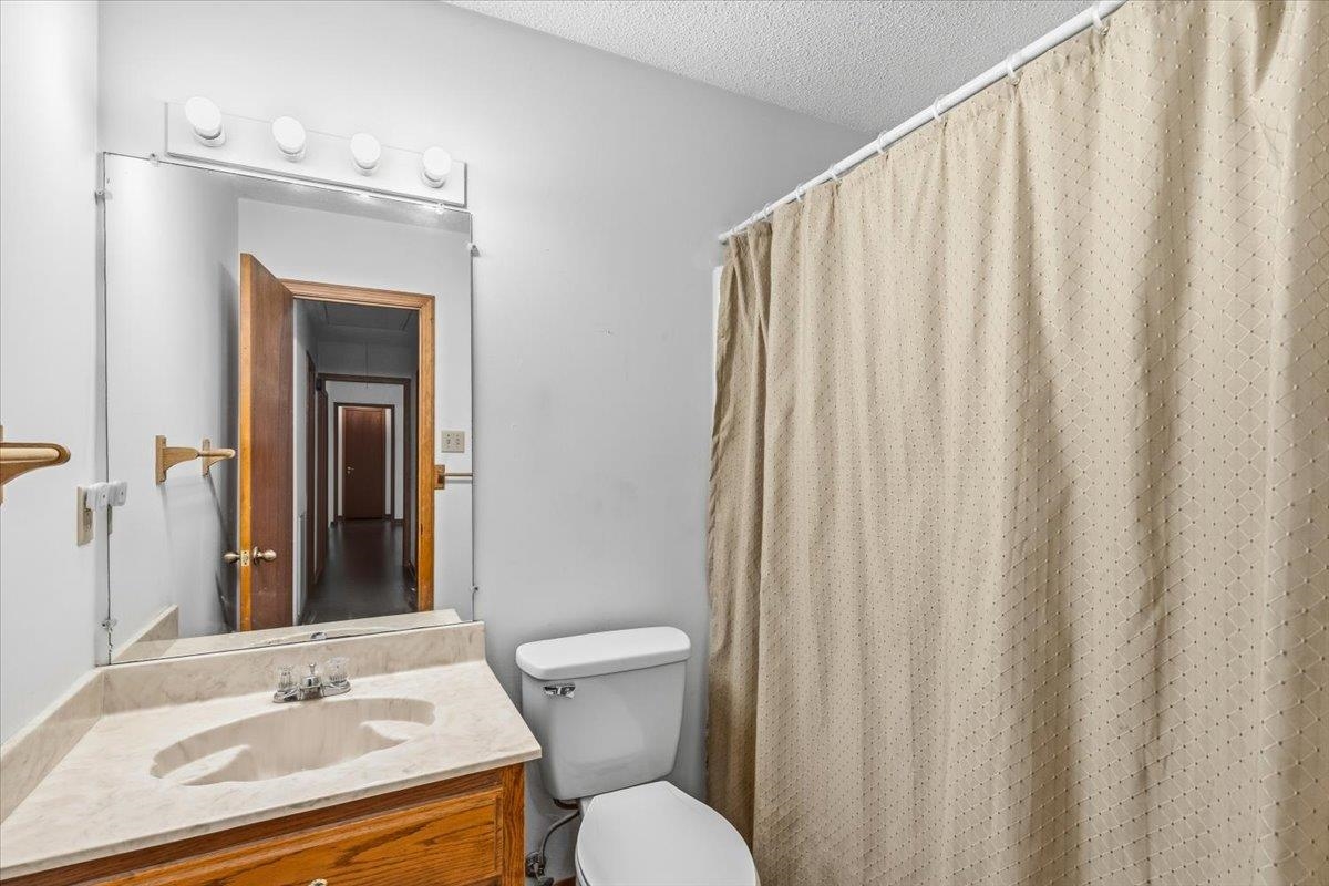 1426 Simmons Road Drummonds, TN 38023 - Photo 23 of 29 a bathroom with a sink and a mirror