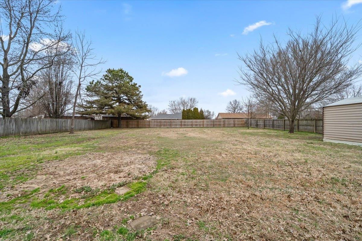 1426 Simmons Road Drummonds, TN 38023 - Photo 26 of 29 a view of a yard with a house