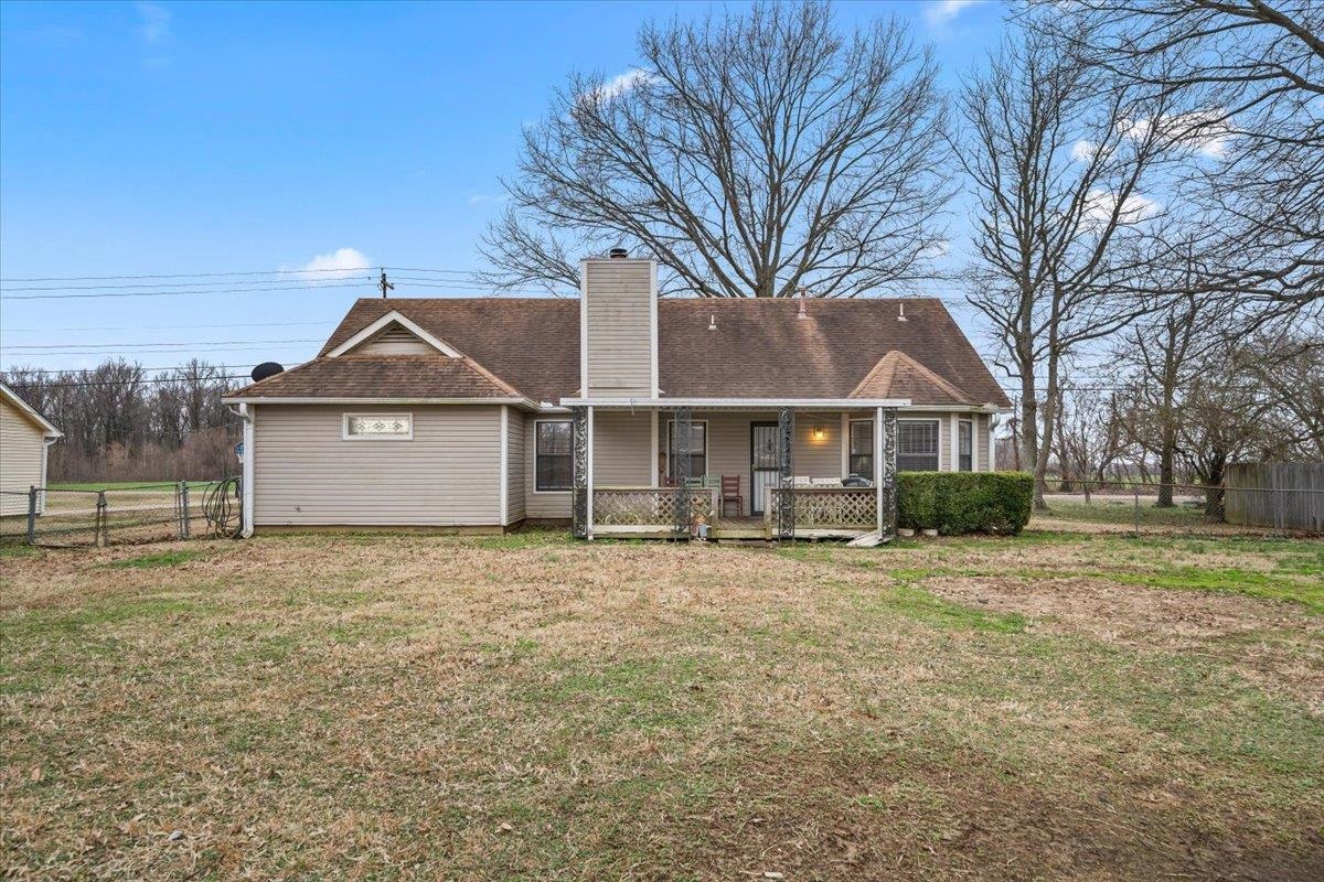 1426 Simmons Road Drummonds, TN 38023 - Photo 27 of 29 a front view of a house with a yard