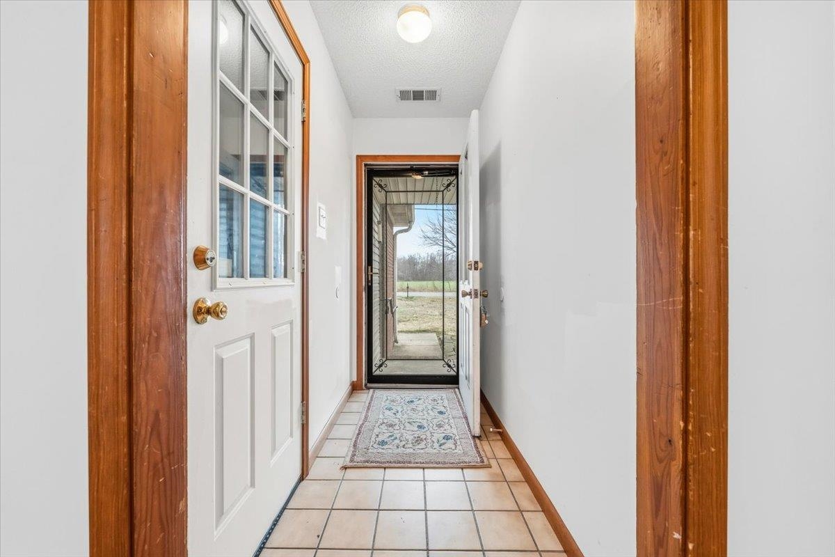 1426 Simmons Road Drummonds, TN 38023 - Photo 5 of 29 a view of a hallway with a flower pot
