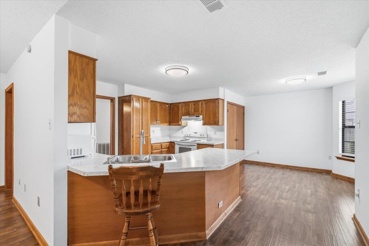 1426 Simmons Road Drummonds, TN 38023 - Photo 9 of 29 a large kitchen with kitchen island a large window a sink and a counter space