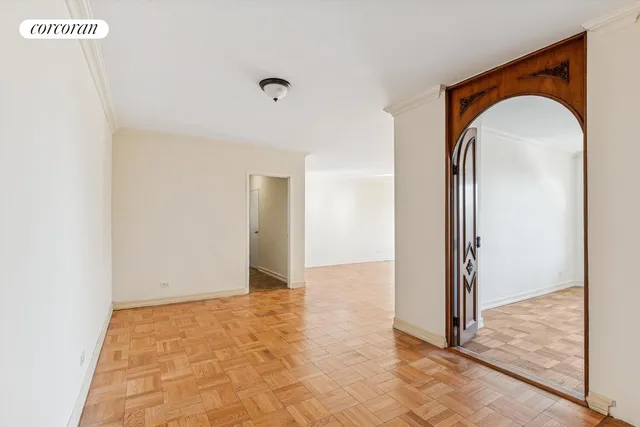 a living room with a large window and a table