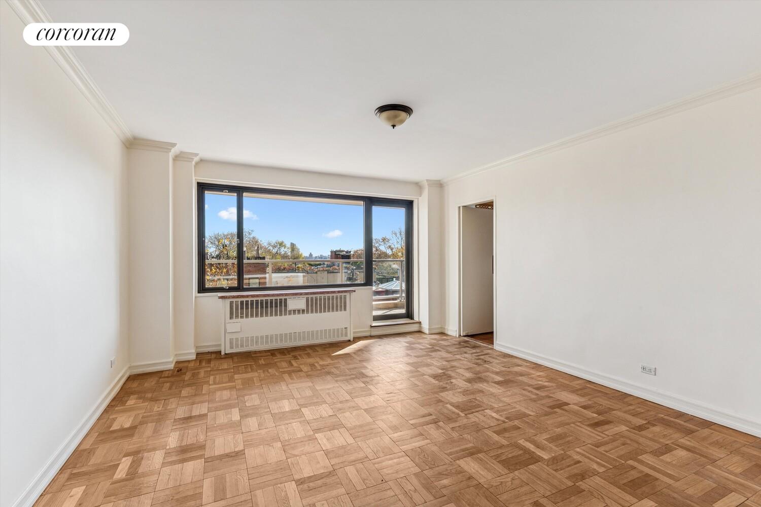 535 East 86th Street, Unit 6F Manhattan, NY 10028 - Photo 15 of 22 a view of a big room with wooden floor and windows