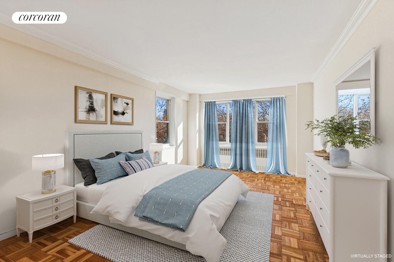 535 East 86th Street, Unit 6F Manhattan, NY 10028 - Photo 6 of 22 a bedroom with a large bed and a potted plant