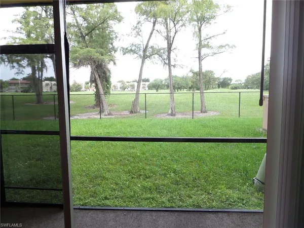 a view of a yard with a lake view