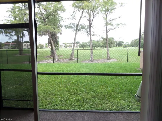 a view of a yard with a lake view