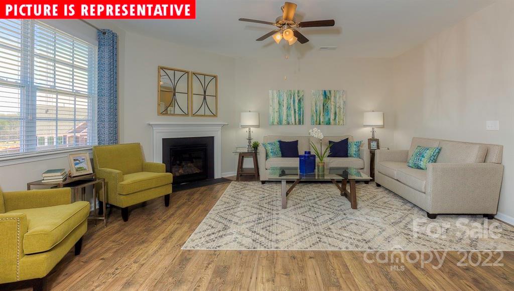 104 Kona Road Mooresville, NC 28117 - Photo 12 of 38 a living room with furniture and a fireplace