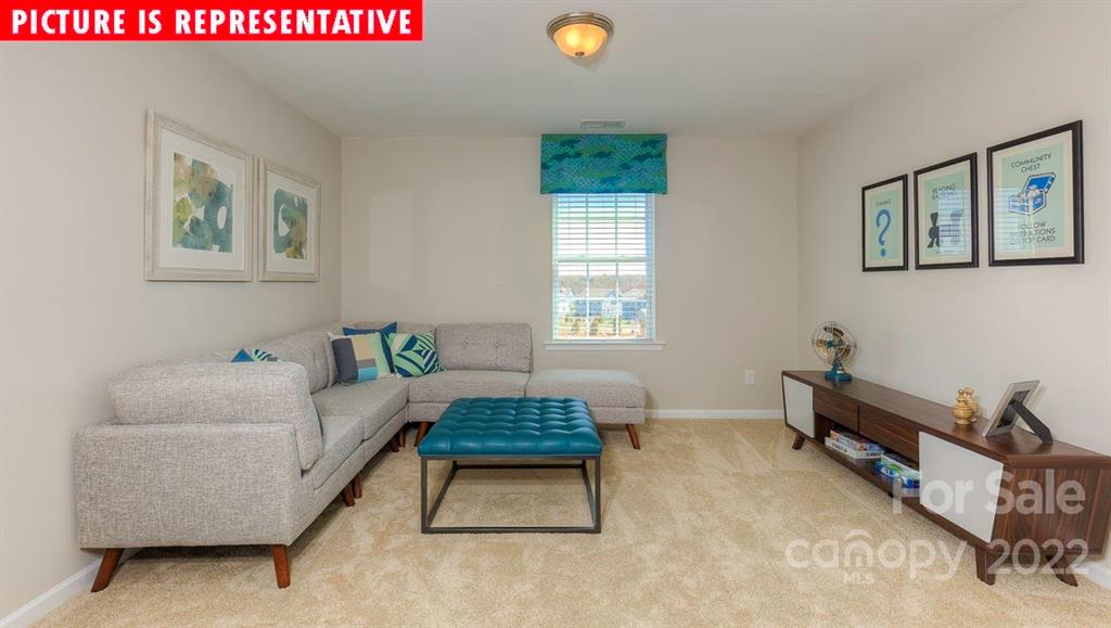 104 Kona Road Mooresville, NC 28117 - Photo 21 of 38 a living room with furniture and a window