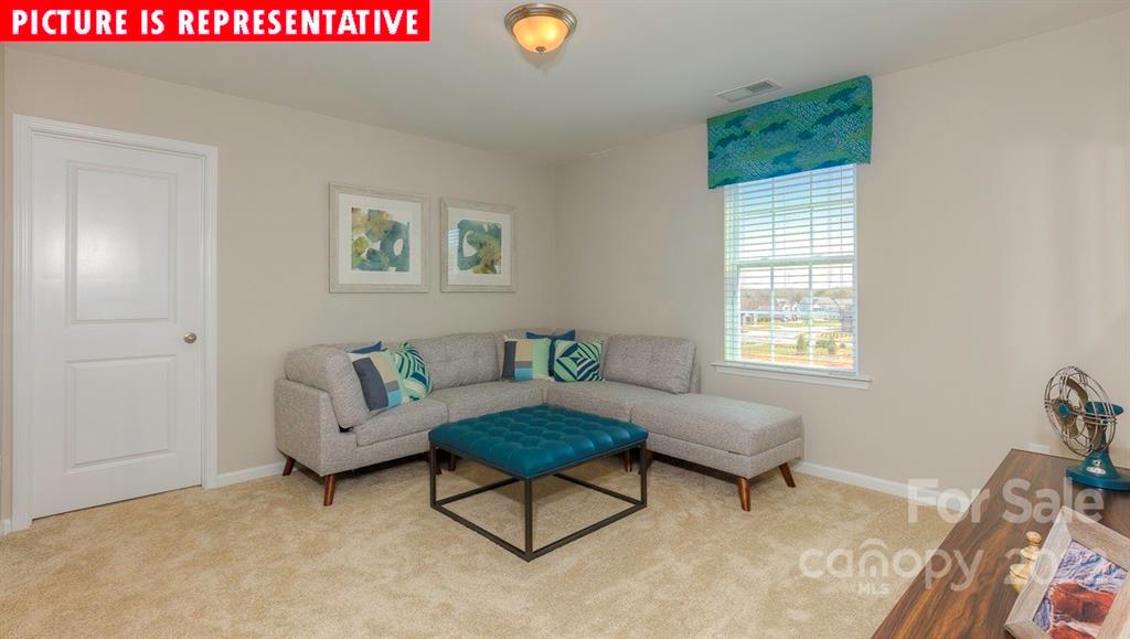 104 Kona Road Mooresville, NC 28117 - Photo 22 of 38 a living room with furniture and a window