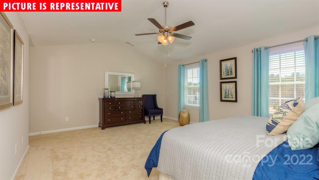 104 Kona Road Mooresville, NC 28117 - Photo 26 of 38 a bedroom with a bed and window