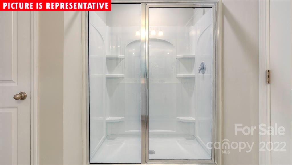 104 Kona Road Mooresville, NC 28117 - Photo 28 of 38 a bathroom with a glass shower door