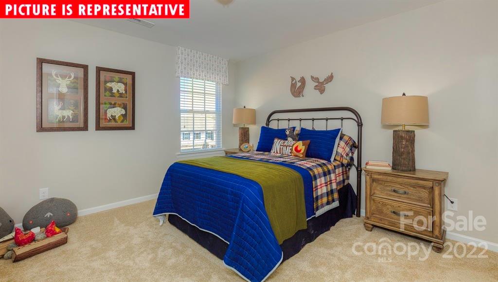 104 Kona Road Mooresville, NC 28117 - Photo 30 of 38 a bedroom with a bed and window
