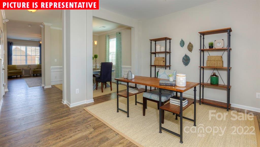 104 Kona Road Mooresville, NC 28117 - Photo 3 of 38 a dining room with furniture and wooden floor