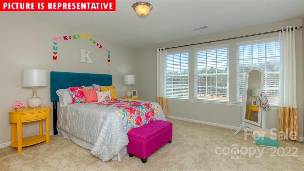 104 Kona Road Mooresville, NC 28117 - Photo 35 of 38 a bedroom with a bed and a window