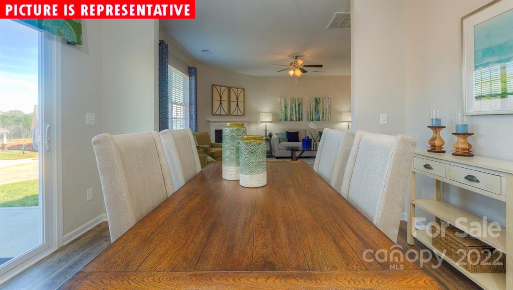 104 Kona Road Mooresville, NC 28117 - Photo 6 of 38 a living room with furniture and a wooden floor