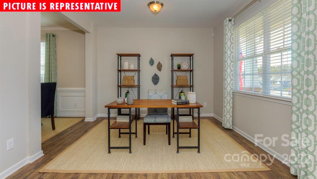 104 Kona Road Mooresville, NC 28117 - Photo 8 of 38 a view of a dining room with furniture and wooden floor