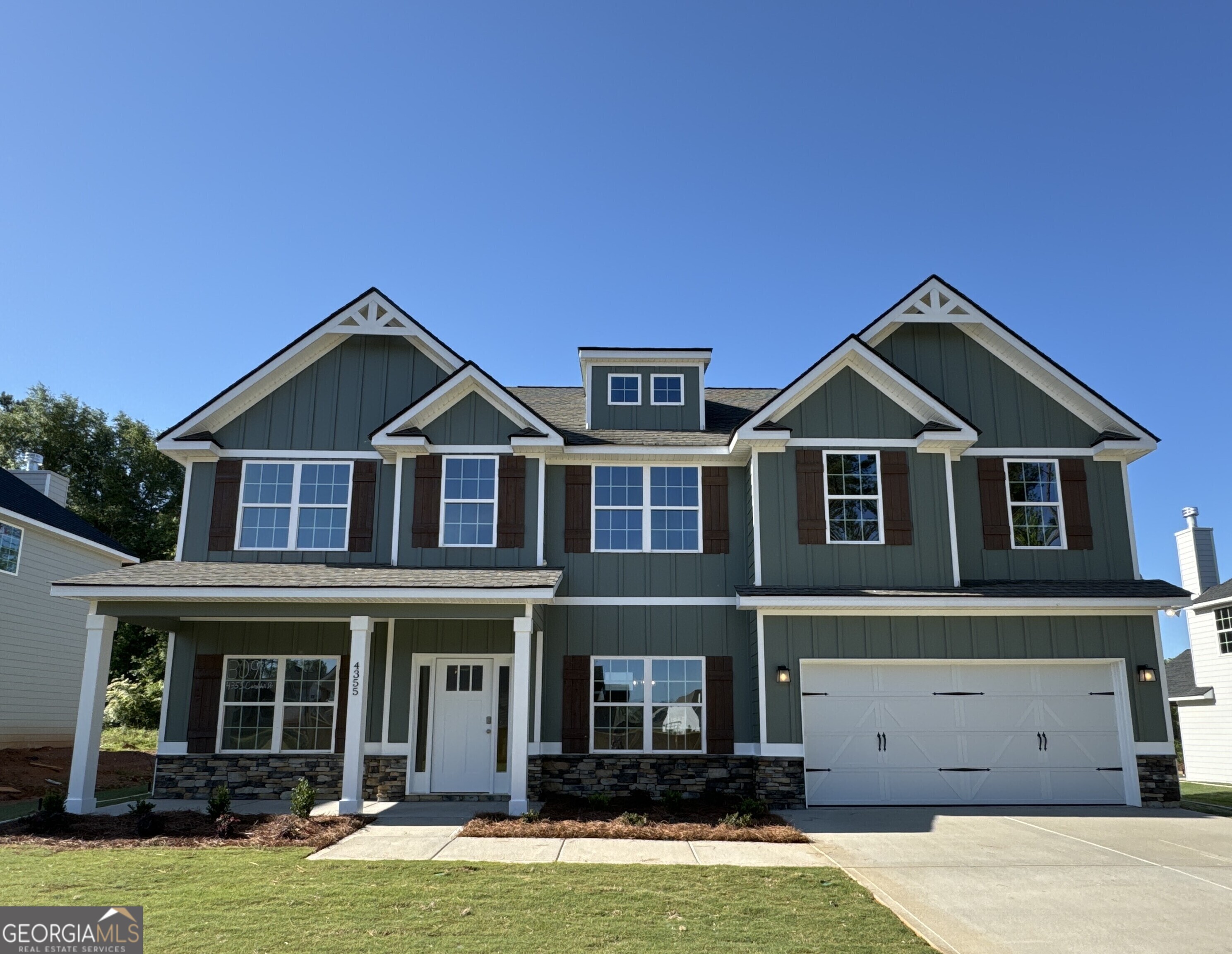 a front view of a house with yard