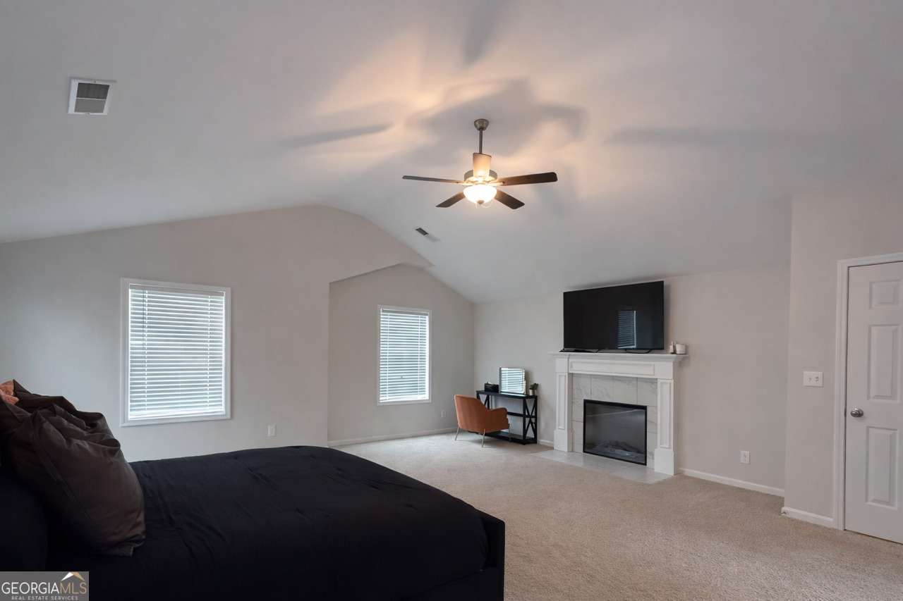 4355 Cornwall Drive Forsyth, GA 31029 - Photo 12 of 23 a living room with fireplace furniture and a flat screen tv