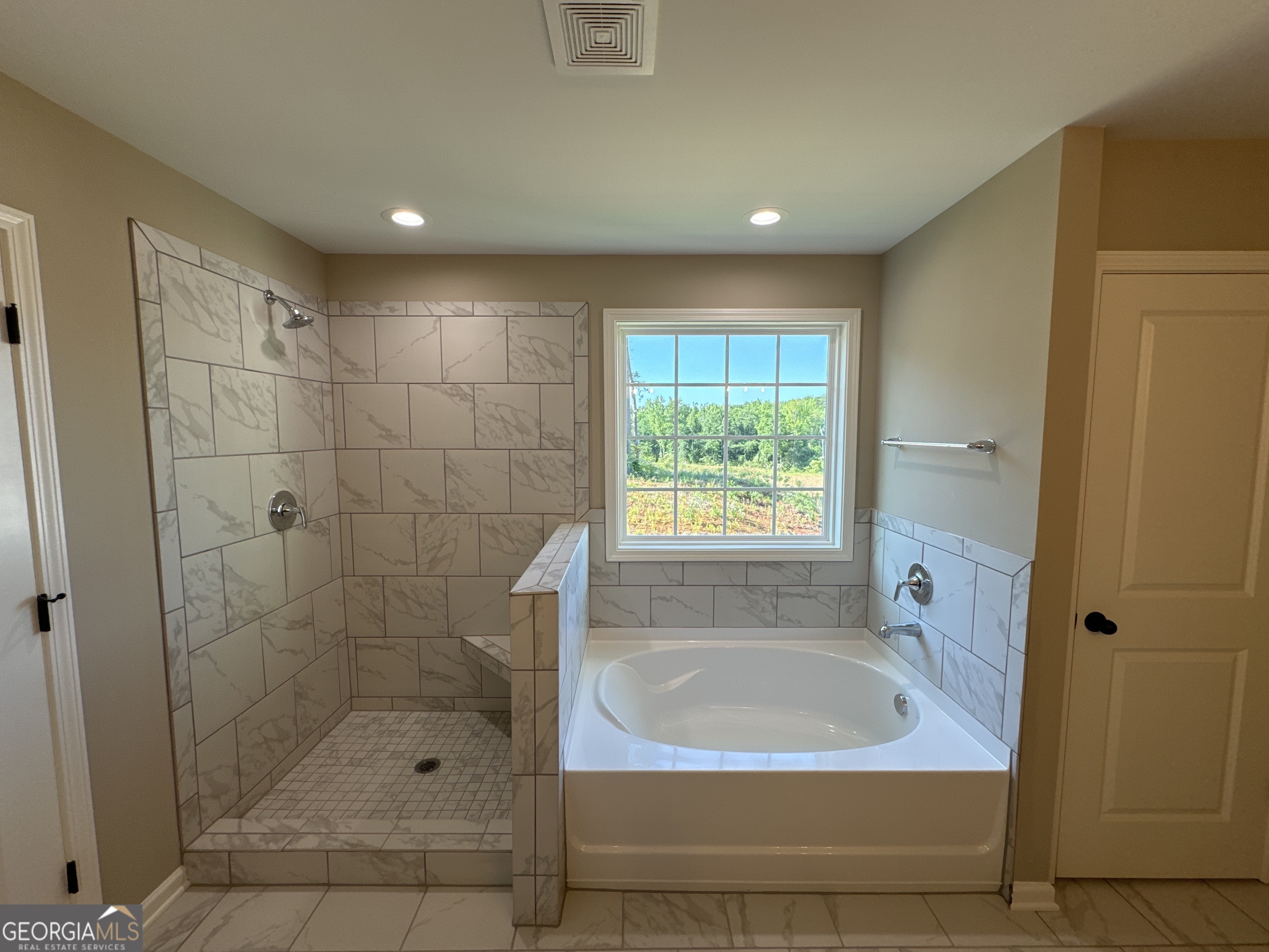 4355 Cornwall Drive Forsyth, GA 31029 - Photo 14 of 23 a bathroom with a bathtub and a shower
