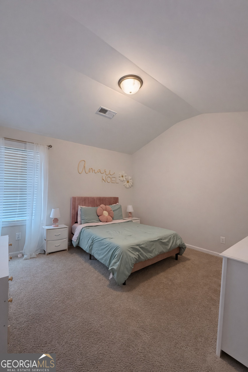4355 Cornwall Drive Forsyth, GA 31029 - Photo 15 of 23 a spacious bedroom with a bed and a couch