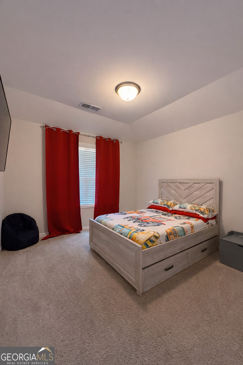 4355 Cornwall Drive Forsyth, GA 31029 - Photo 16 of 23 a bedroom with a bed and window