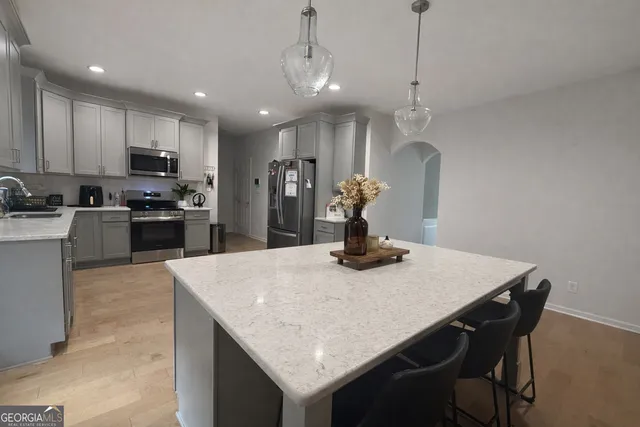 a kitchen with a dining table and chairs