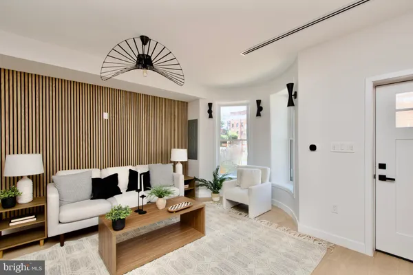 a living room with furniture and a rug