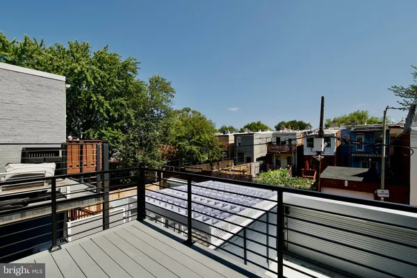 a view of a balcony with wooden floor