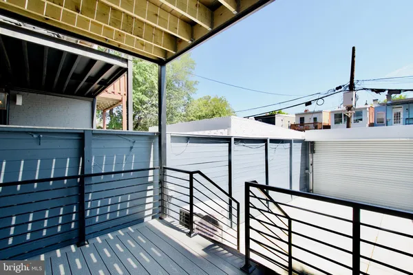 a view of balcony with wooden floor