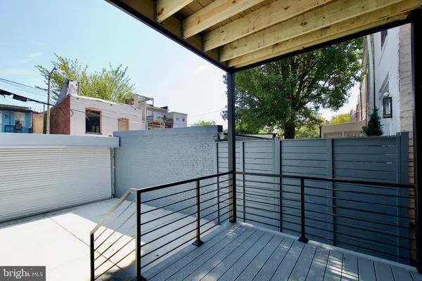 a view of a balcony with wooden floor