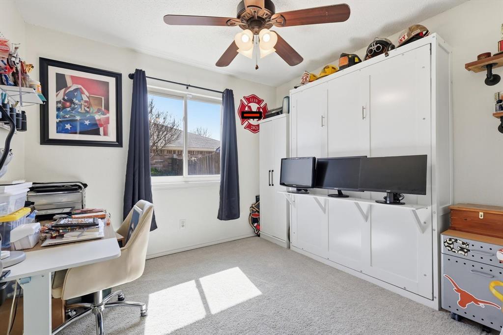 205 Comanche Trail Krum, TX 76249 - Photo 13 of 24 a living room with furniture and a flat screen tv